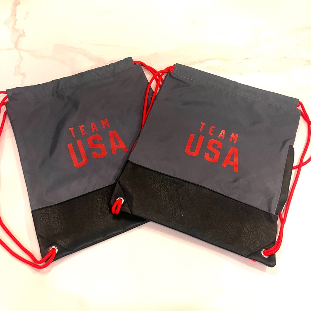 Two Team USA Drawstring Backpacks w/leather-like base (brand new)
